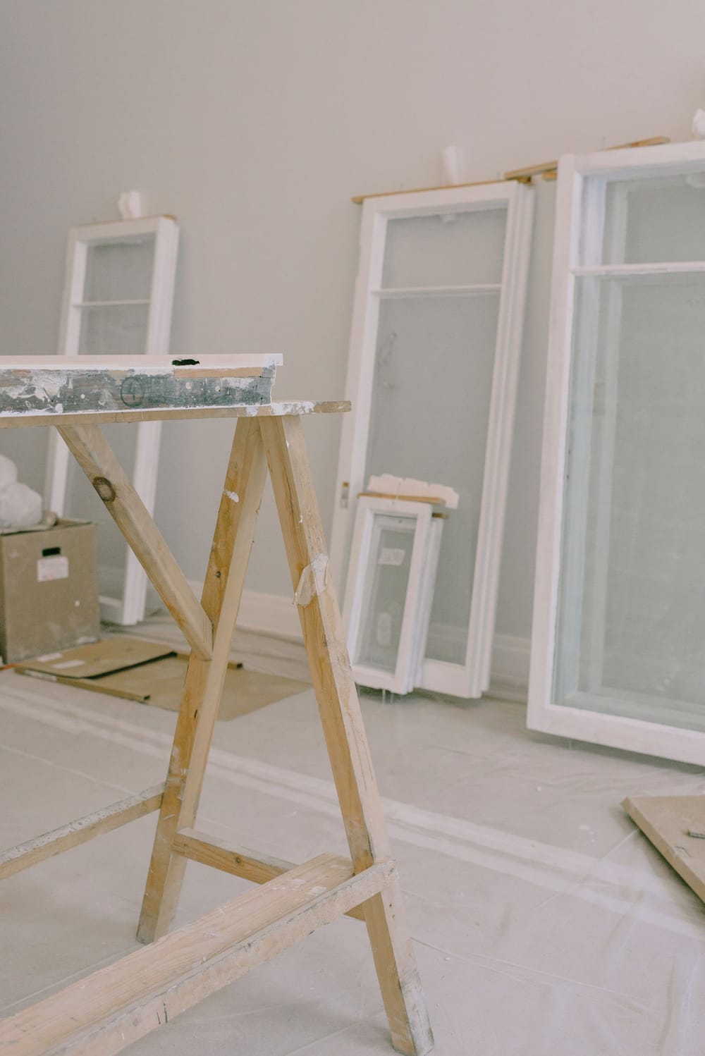 Window frames prepared on trestles during an interior renovation